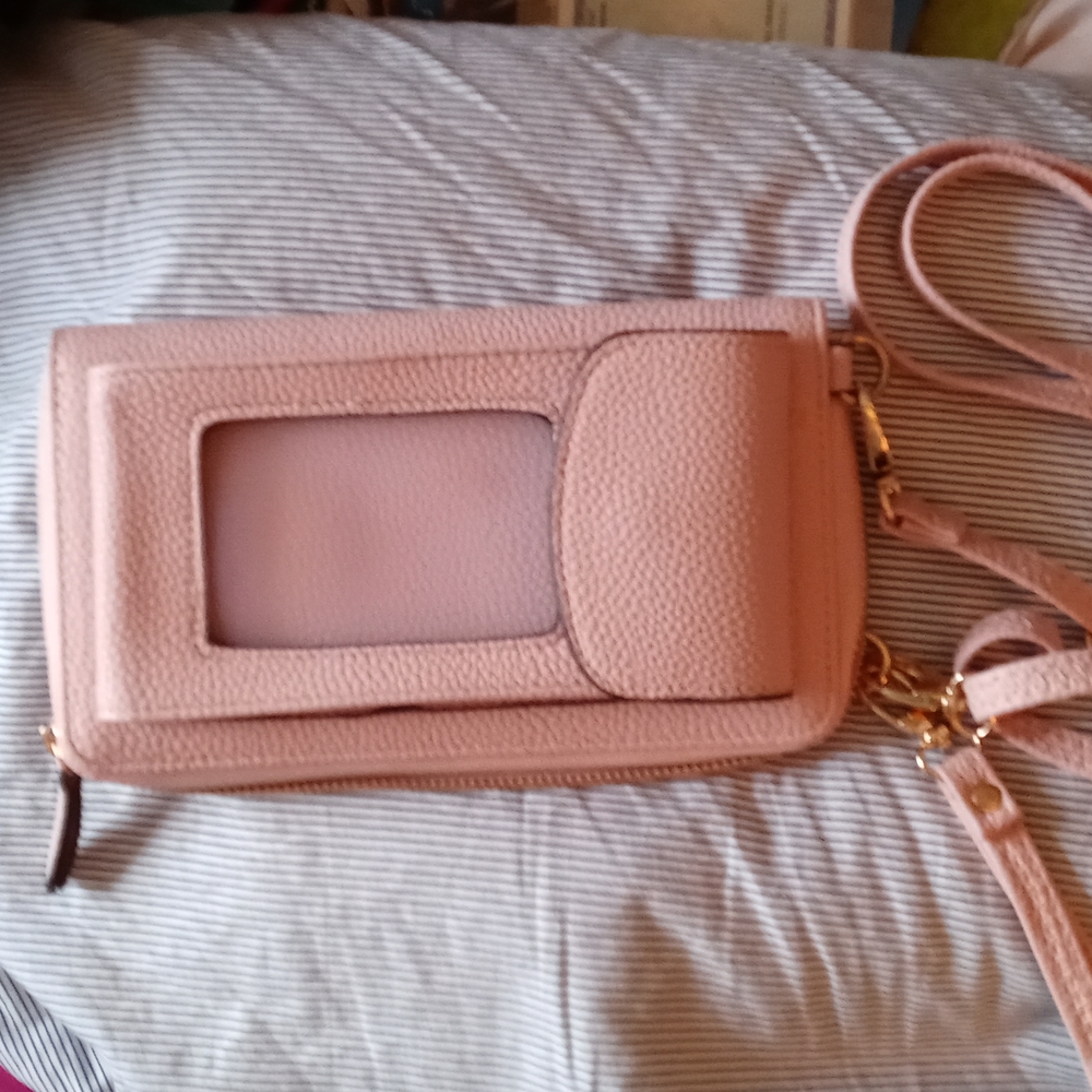 Light pink clutch with phone holder. Wallet size.